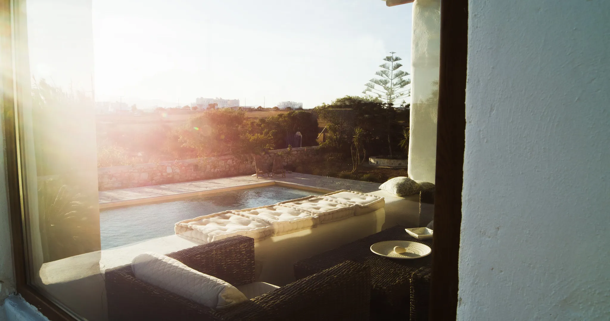 Lithos Private Estate shaded outdoor seating at golden hour