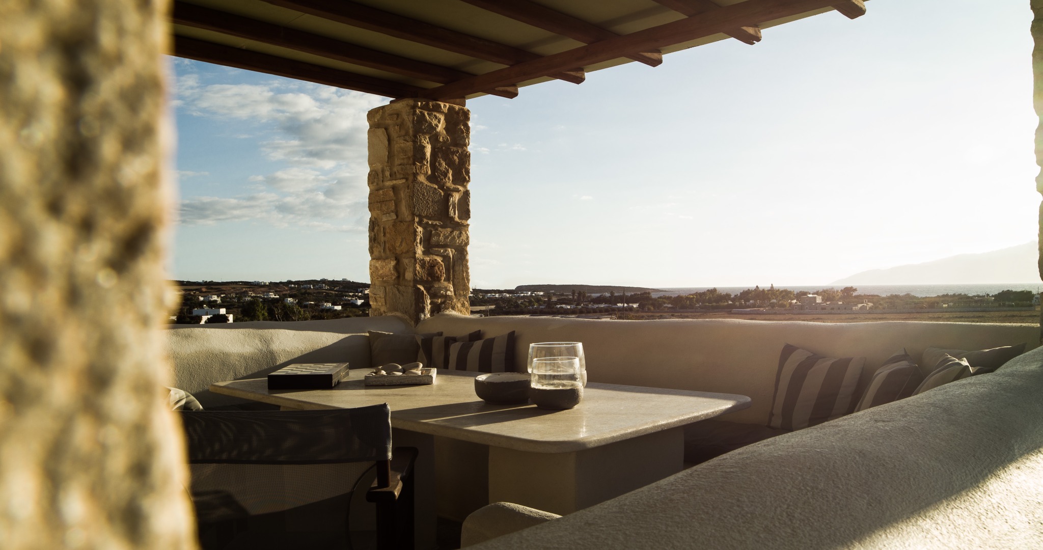 Lithos Private Estate covered terrace with island view
